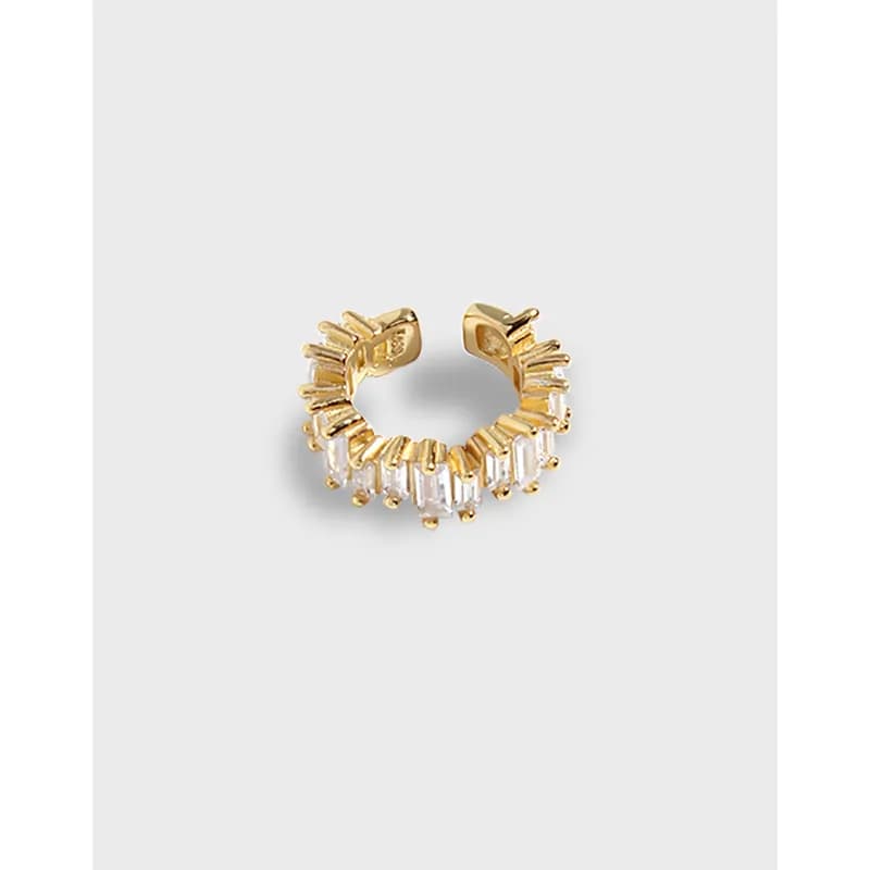 Open hoop earring with baguette rectangular accents around the edge in gold-tone finish.