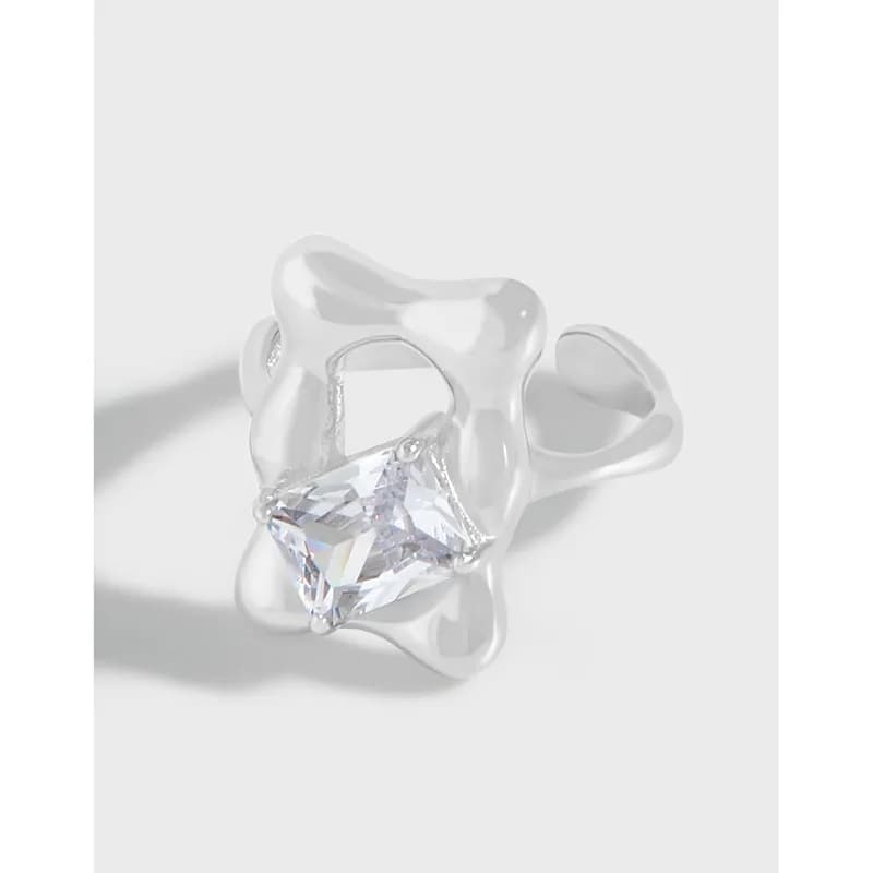 Polished sterling silver ring with a square-cut gemstone set in a petal-shaped open frame.