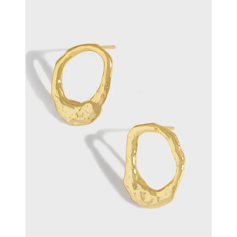 Polished sterling silver hammered hoop earrings shown against a light background.