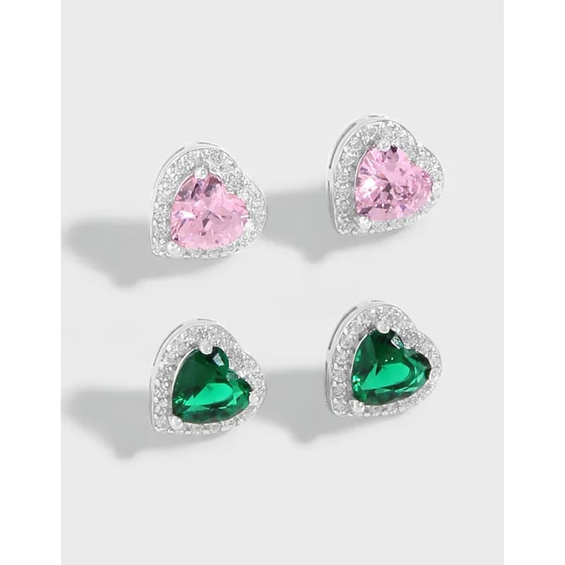 Four heart-shaped stud earrings with pink and green center stones surrounded by crystal halos in silver