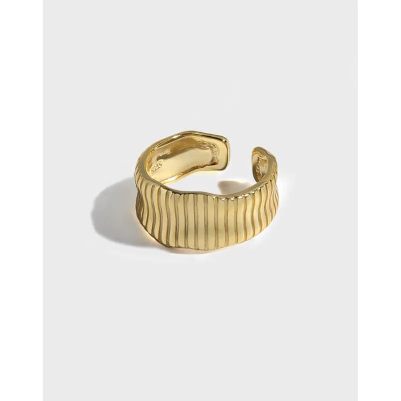Polished sterling silver ribbed band ring with an open adjustability