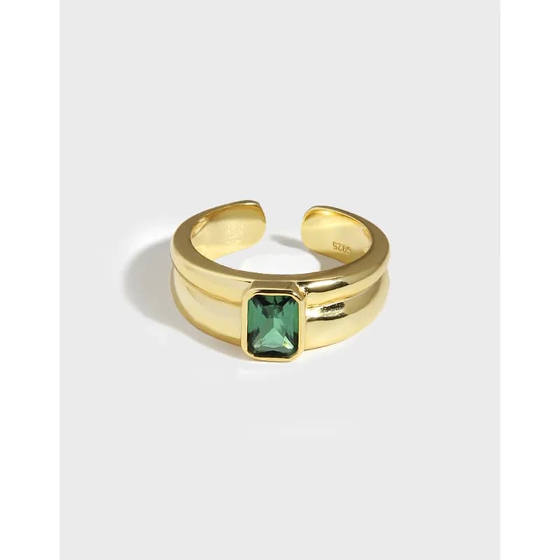 Gold-tone double-band ring with a squared emerald-cut green gemstone set in a raised bezel