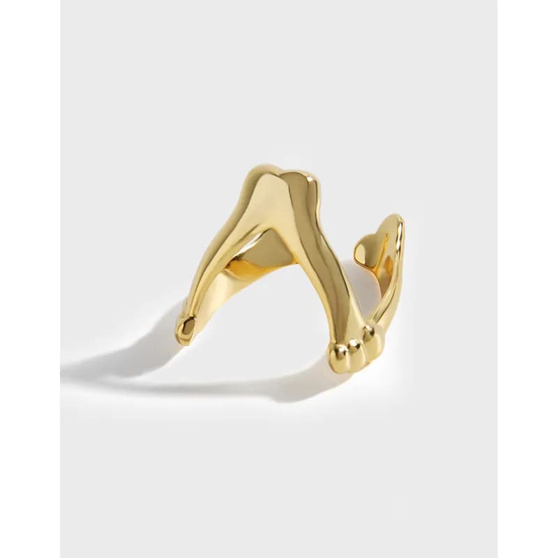 Polished sterling silver open-ring with a sculptural wave wraparound.