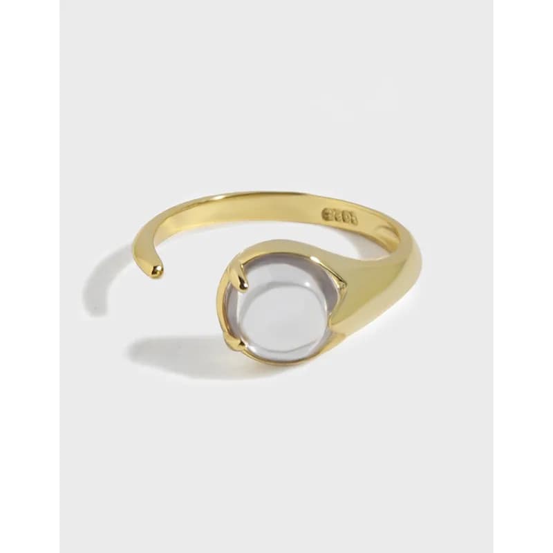 Polished sterling silver ring with an open circular centerpiece on a clean white background.
