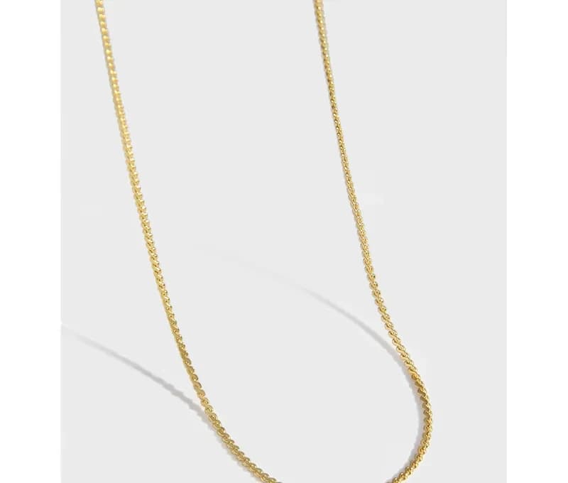 Polished sterling silver curb chain necklace displayed against a white background.