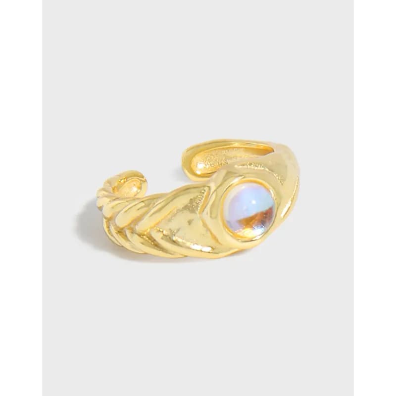Polished sterling silver rope earring with a bezel-set moonstone cabochon on a curved, open hoop.