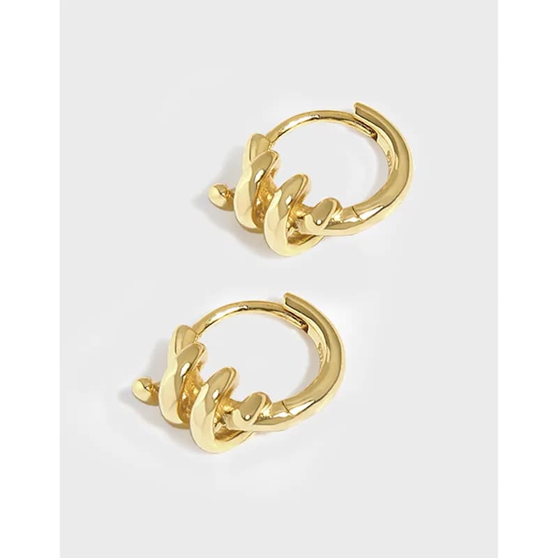 Polished sterling silver hoop earrings with stacked leaf-like petals on a white background.