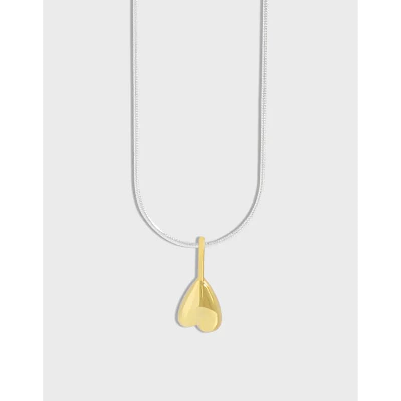Sterling silver chain necklace with a gold-tone heart pendant