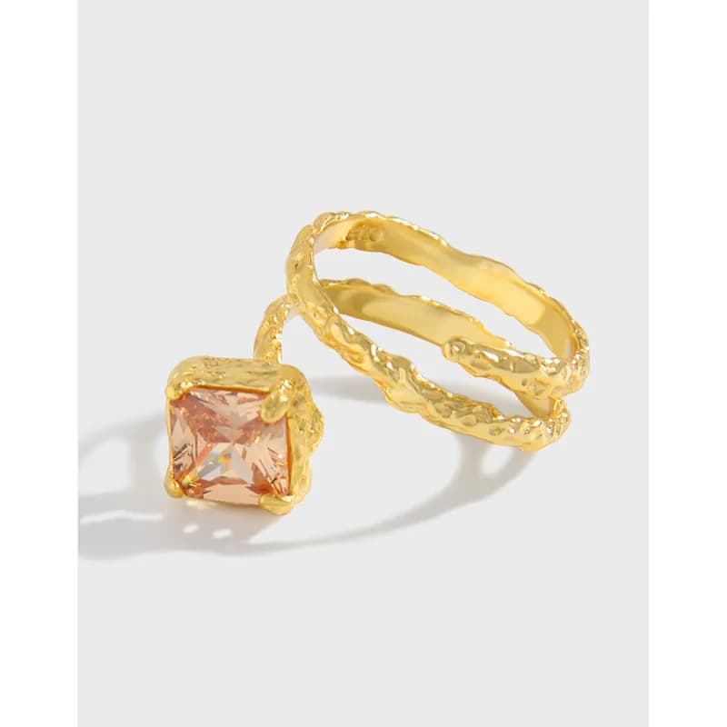 Polished sterling silver triple-band ring with a square peach gemstone