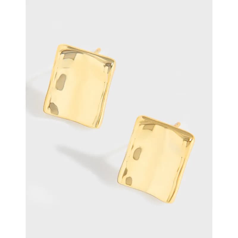 Polished square plaque earrings in sterling silver on a light background.
