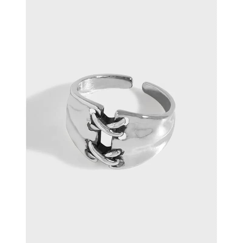 Bold wide sterling silver ring with a raised chain-link detail on a matte finish band.