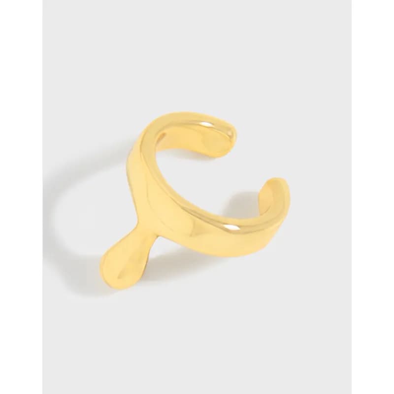 Polished curved open hoop earring in sterling silver with a teardrop tip, shown in a gold-tone finish.
