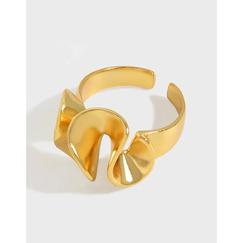 Polished gold-tone open ring with a sculptural twisted loop centerpiece.