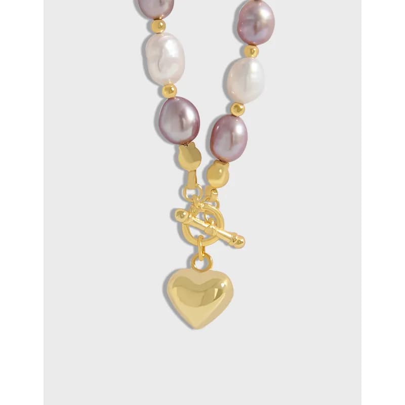 Polished silver necklace with pink and white baroque pearls and a heart pendant