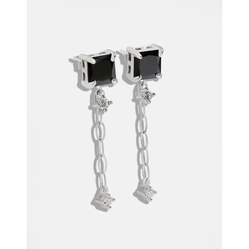 Sterling silver square onyx drop earrings with delicate chain and crystal accents.