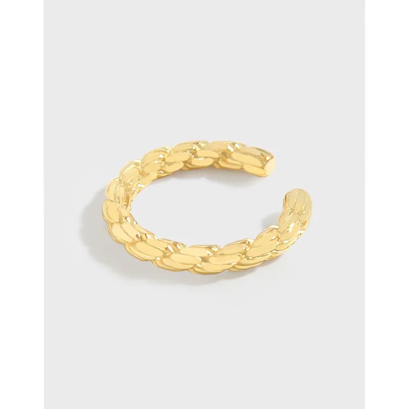 Open-ended braided rope ring in polished sterling silver on a light background.