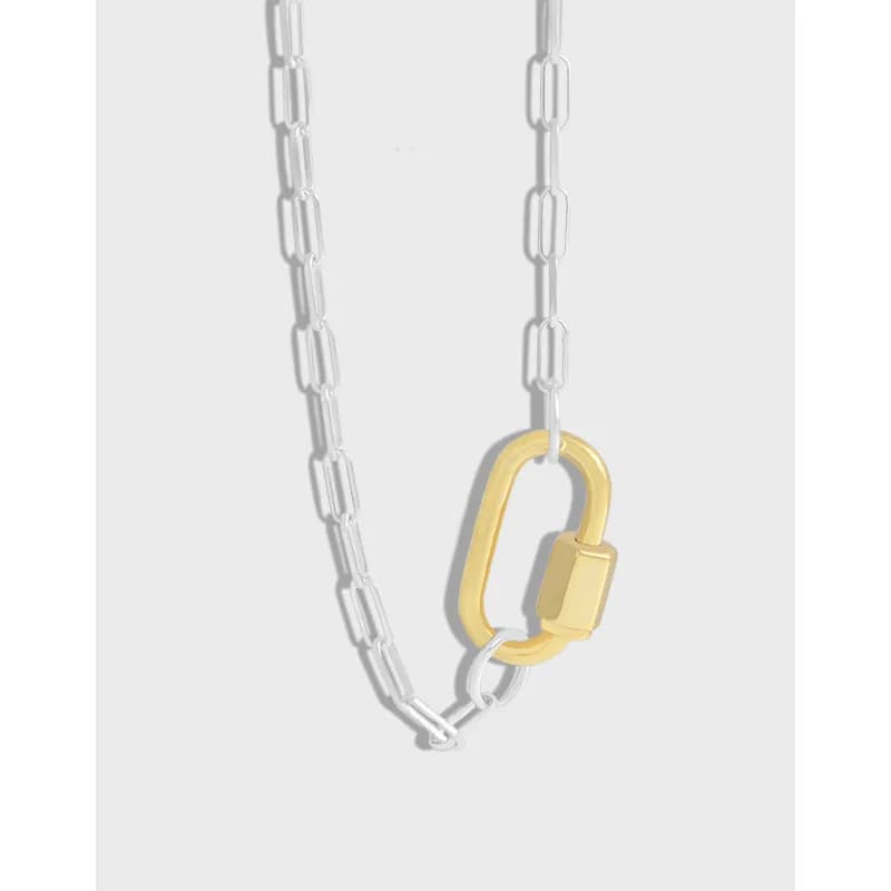 Polished sterling silver chain with a gold-tone oval pendant and rectangular link accents.