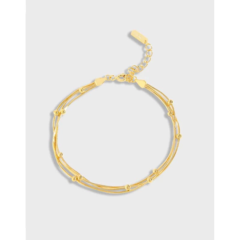 Polished sterling silver double-strand bracelet with small beaded accents and adjustable chain
