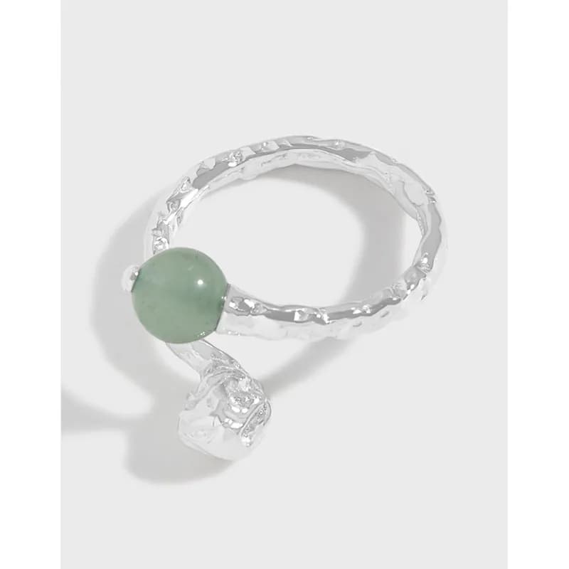 Sterling silver textured-band ring with a green jade bead and a dangling clear crystal