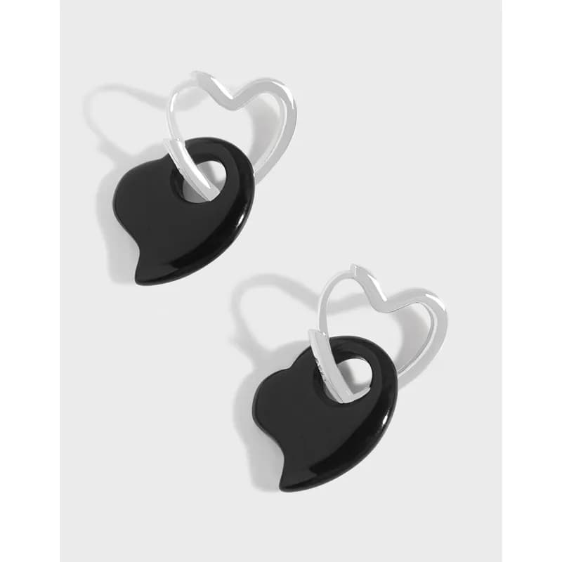 Polished sterling silver heart-outline hoops with black heart pendants in a two-tone drop earring design.
