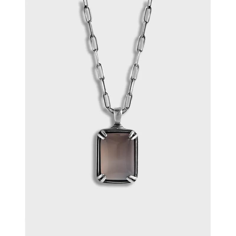 Matte sterling silver necklace with a square cushion-cut pendant on an elongated-link chain.