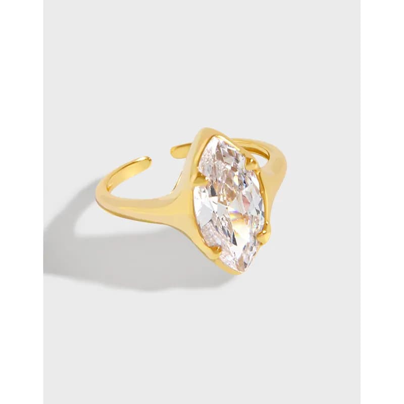 Polished sterling silver ring with a large marquise-cut crystal in an open bypass setting
