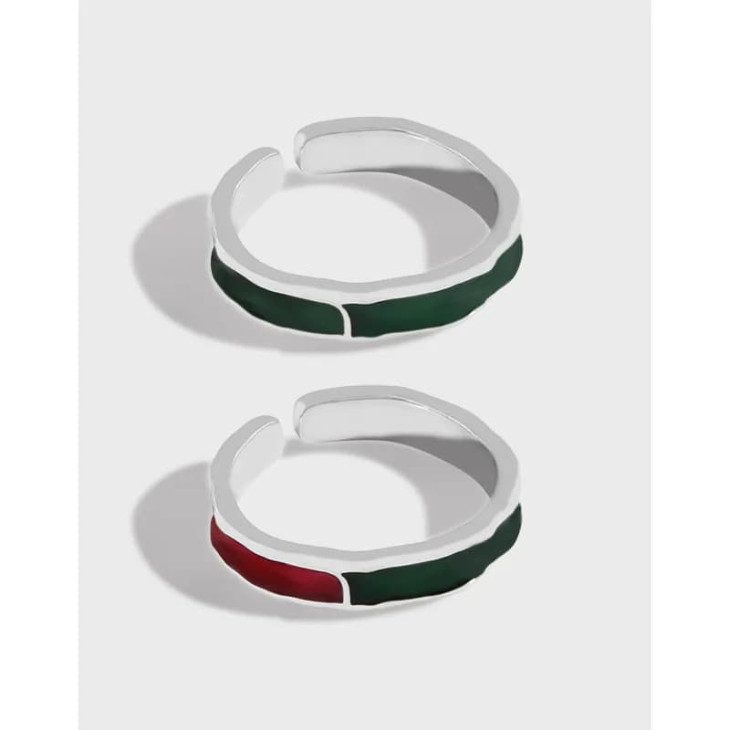 Open-ended sterling silver ring with green enamel inlay on the outer edge.