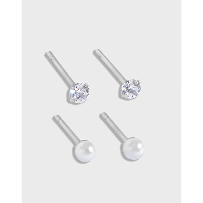 Sterling silver bar-post stud earrings, with clear crystals and pearls, shown together.