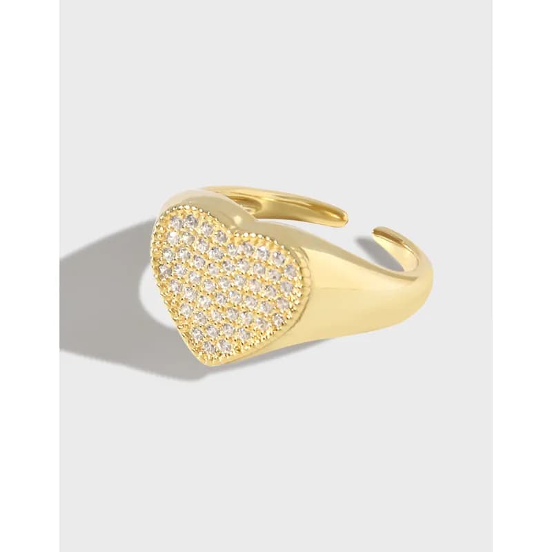 Open-ended heart-shaped ring with a pavé crystal face on a polished silver band.
