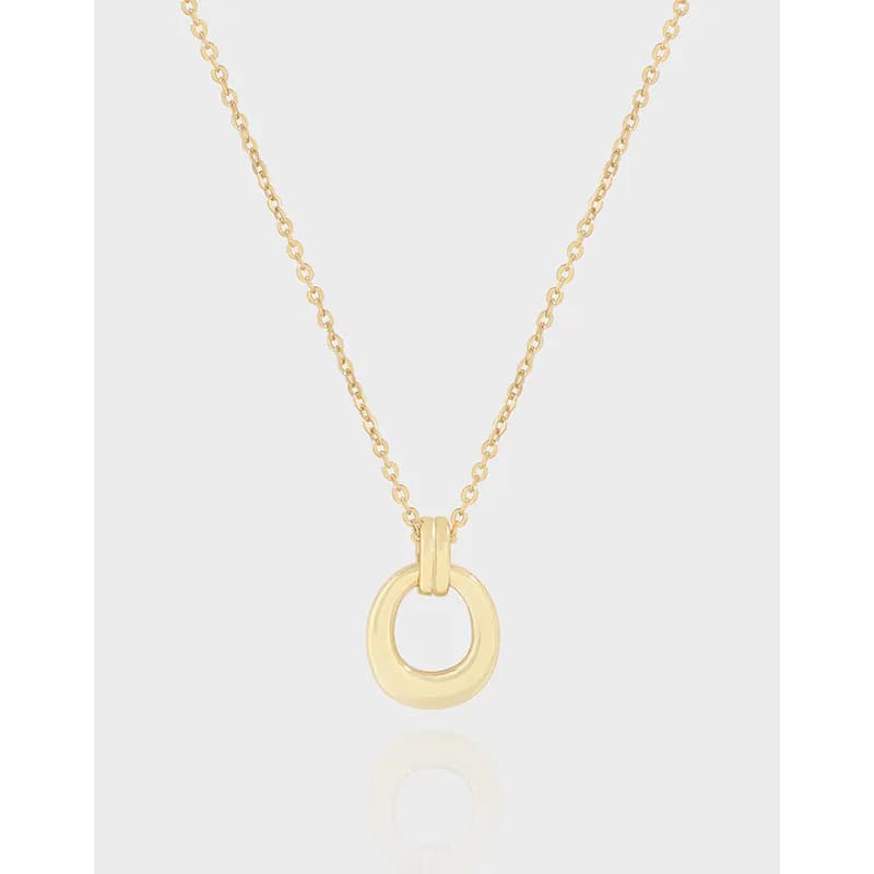 Gold-toned open-ring pendant on a delicate chain