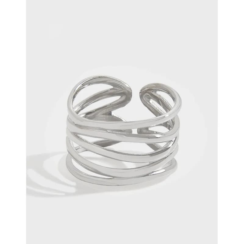 Polished sterling silver wrap ring with multiple interlocking open bands stacked around the finger.