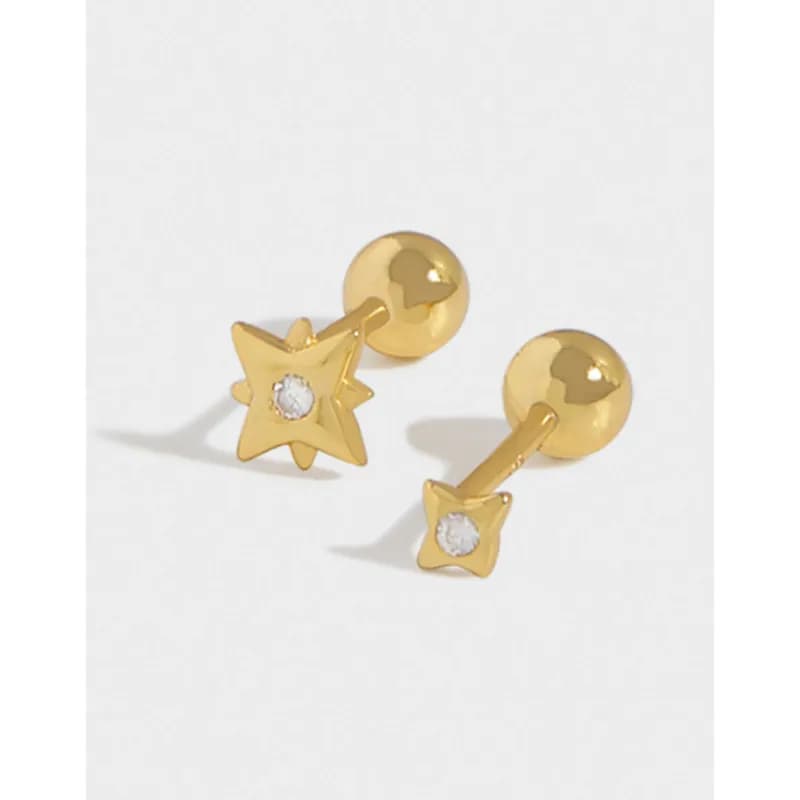 Polished sterling silver starburst stud earrings with a small central gemstone.