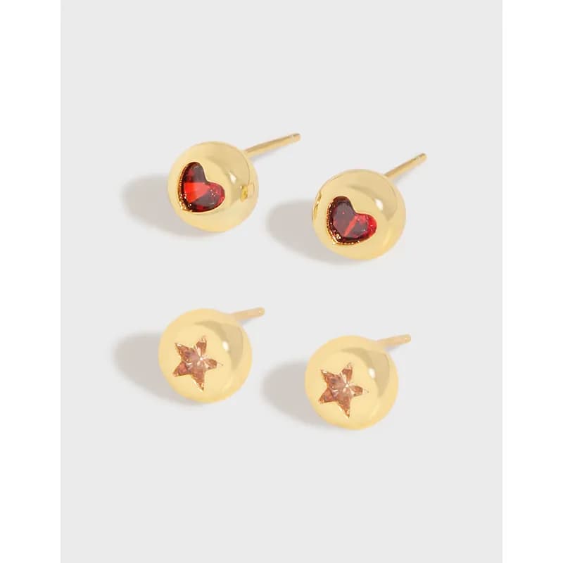 Polished sterling silver round stud earrings in heart and star motifs on a light background.