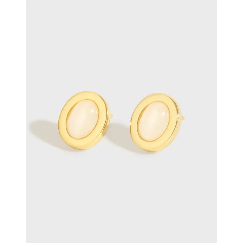 Polished sterling silver oval pearl stud earrings on a light background.