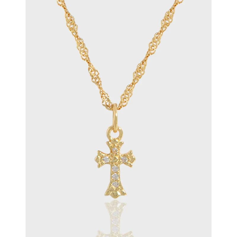 Close-up of a cross pendant on a polished twisted rope chain, showing small stones along the cross.