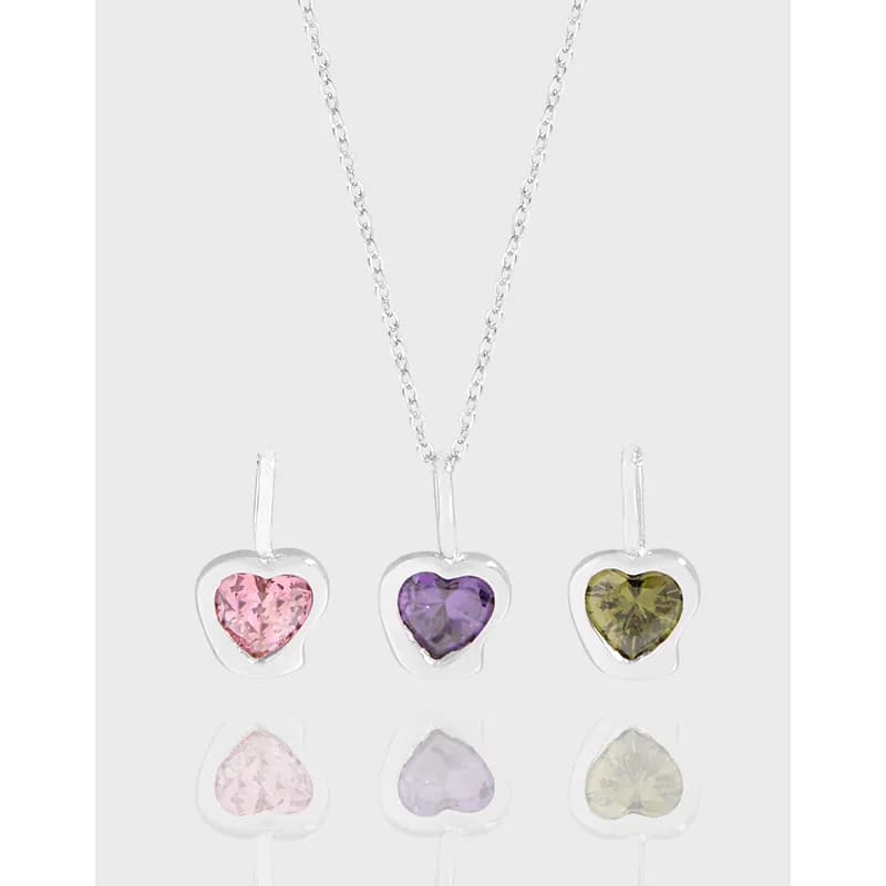 Three heart-shaped enamel pendants in pink, purple, and olive green hang from a sterling silver chain.