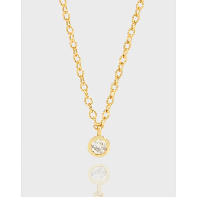 Gold-tone chain necklace with a round bezel-set crystal pendant hanging at the center.