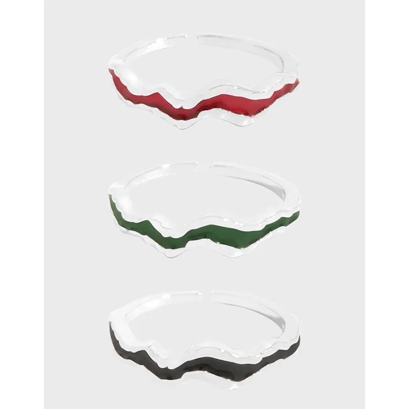 Three sterling silver rings with a scalloped enamel edge in red, green, and black.