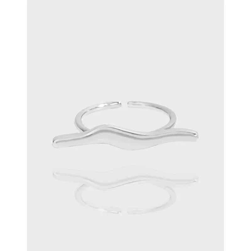 Open-ended polished silver ring with a flowing, wave-shaped band