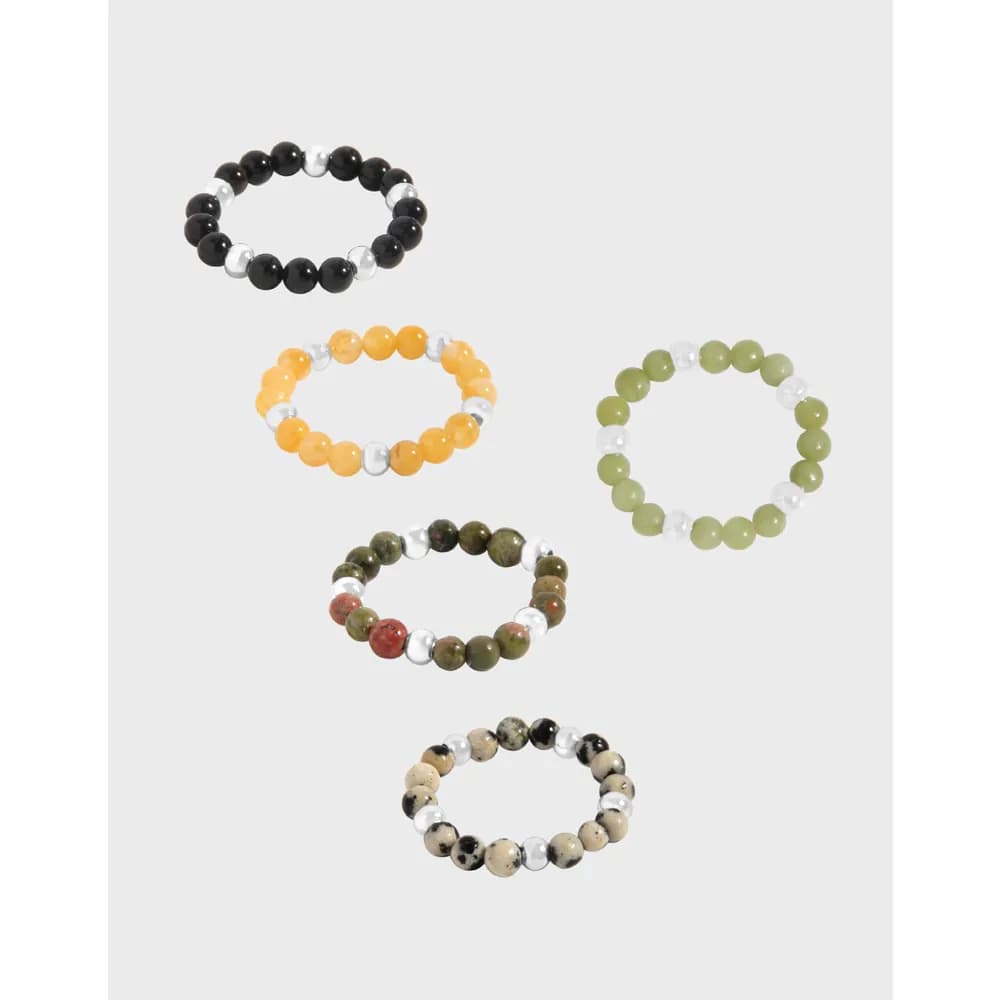 Beaded Sterling Silver Ring shown in multiple colorways with silver spacers on a stretchy band.