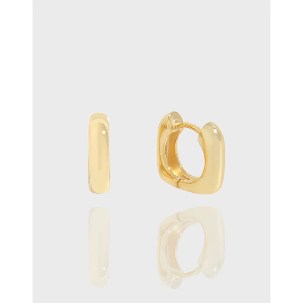 Small polished rectangular hoop earrings with hinged closure in a close-up shot.