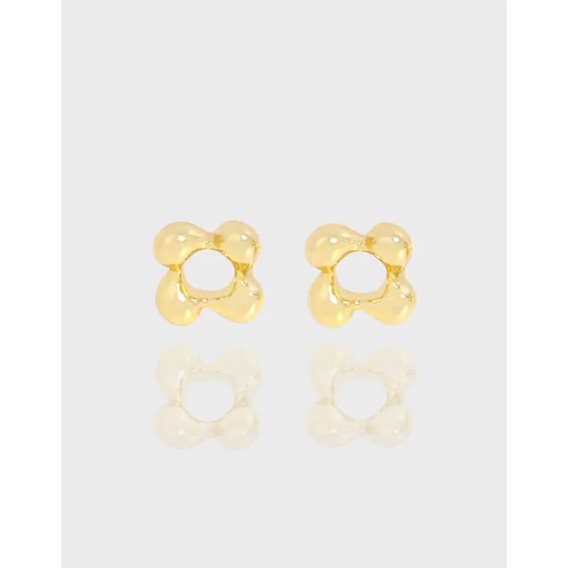 Polished sterling silver quatrefoil stud earrings shown against a light background.