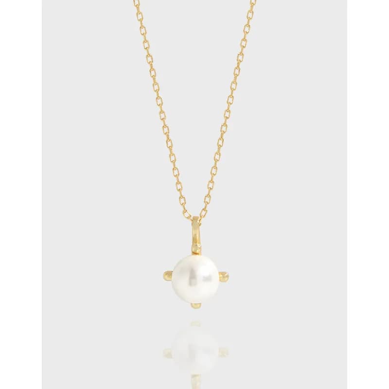 Polished sterling silver necklace featuring a single white pearl pendant