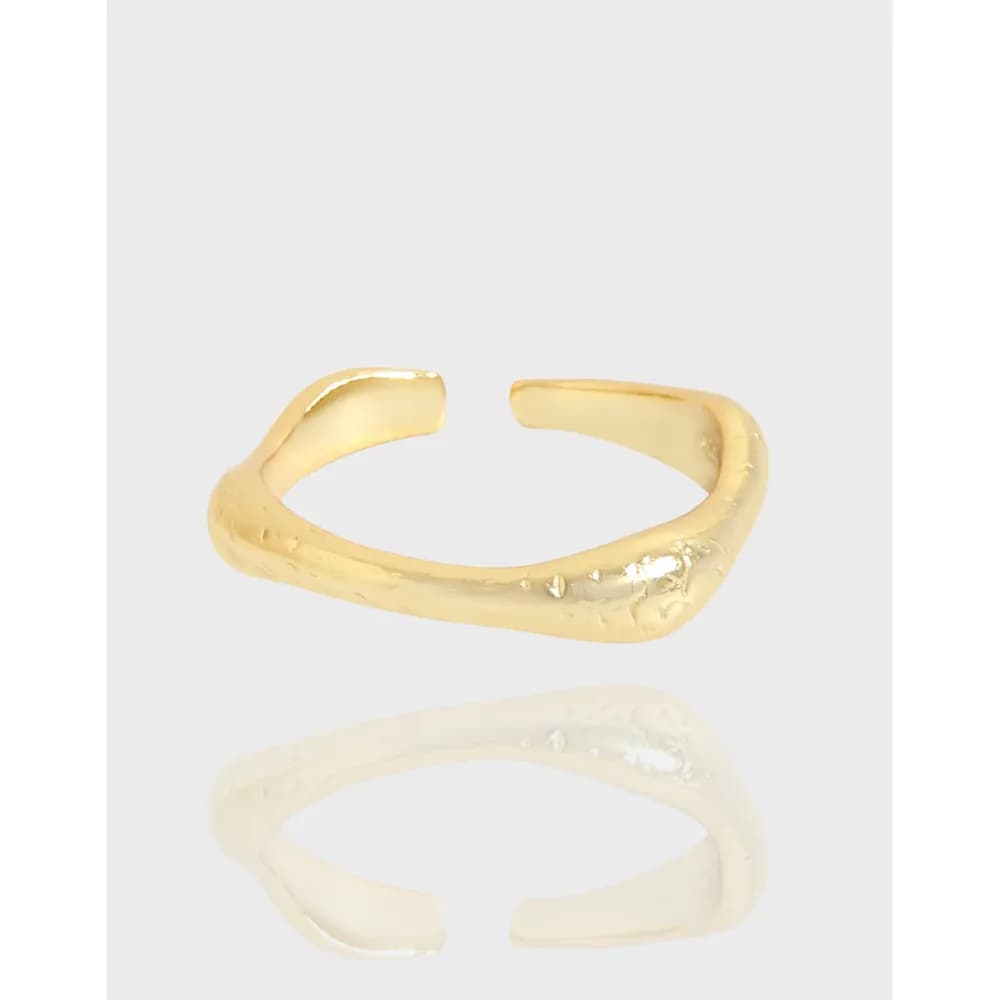 Open, hammered-textured sterling silver ring with two open ends and a polished finish.