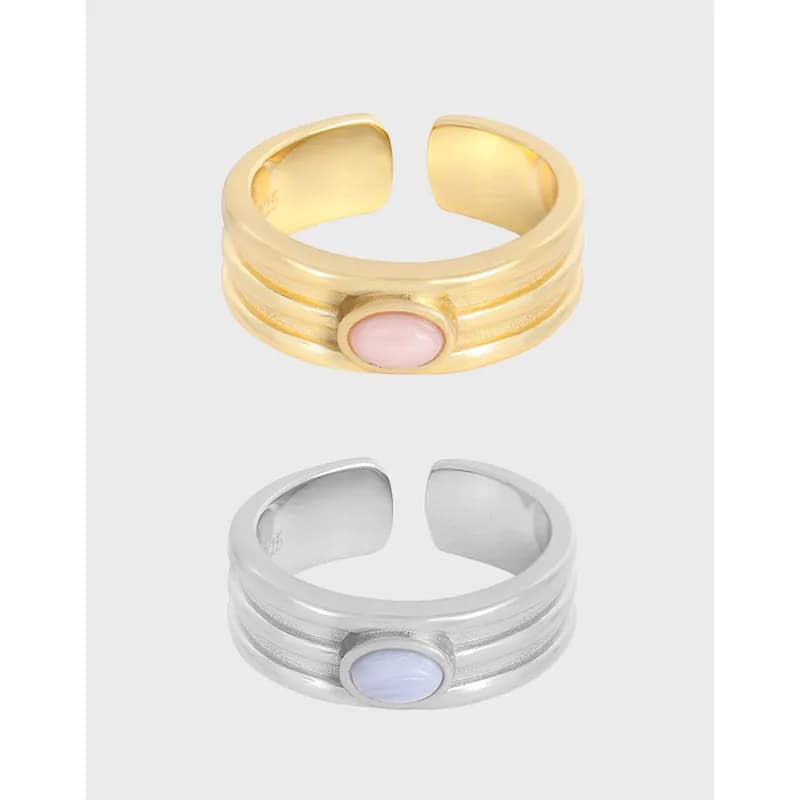 Two-tone two-band ring with pink cabochon bezel on a gold-tone finish