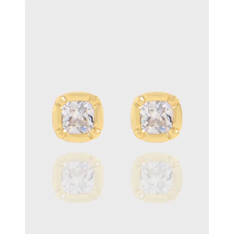 Polished sterling silver cushion-cut stud earrings with square bezel settings and clear stones.