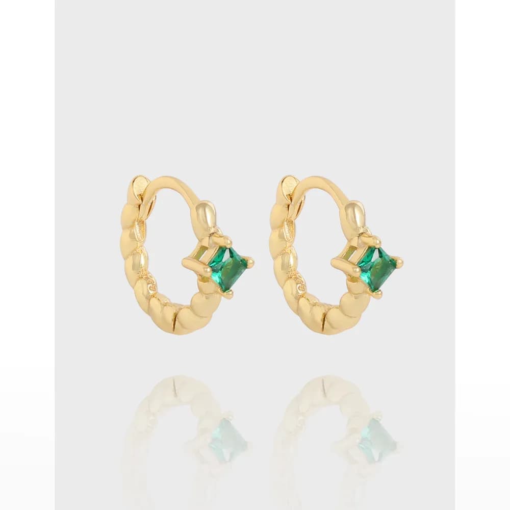 Gold-tone hoop earrings with emerald-cut green stones set on the front