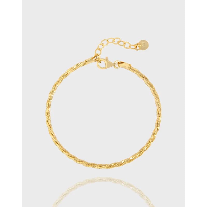 Polished sterling silver beaded chain bracelet with lobster clasp on a light background.