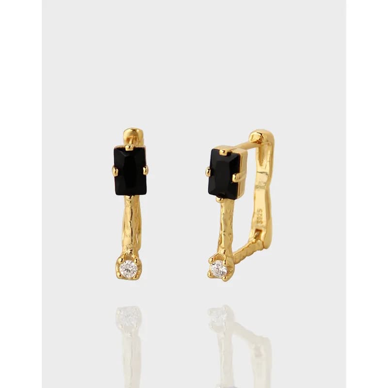 Polished sterling silver earrings with black rectangular stones and a small crystal at the bottom