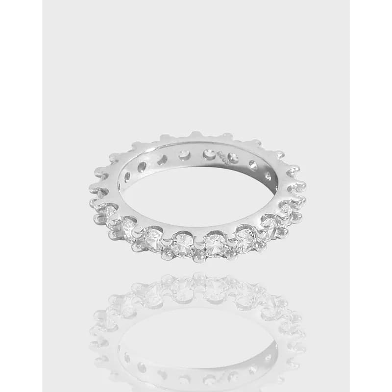 Sterling silver pavé crystal ring with a continuous row of stones around the outer edge.
